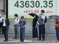 Asian stocks extend gains but US concerns hit dollar, boost gold