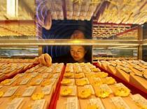 Dollar sinks on yen intervention talk, gold breaks $5,000