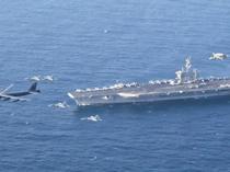 US deploys aircraft carrier as Iran warns against attack