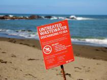 New Zealand mayor swims to allay sewage contamination fears