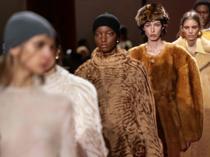 Milan runways highlight faux fur, backless designs, frayed fabrics