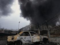 Tehran plunged into darkness by smoke from burning oil