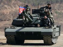 North Korean leader, daughter try out new tank