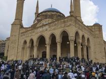 Displacement, air raid sirens weigh on Mideast Eid celebrations