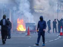 Protesters torch buildings and vehicles, block roads over Belfast stabbing