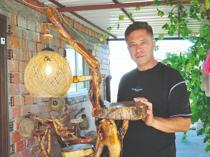 Aigai guard transforms discarded wood into art
