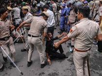Indian police fire tear gas on exam protesters