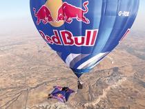 Wingsuit athletes fly among hot air balloons over Cappadocia