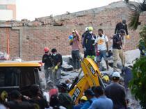 Woman pulled alive from Colombia quake rubble as toll rises