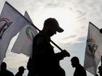 Iraq says arms of mobilization forces will not be collected