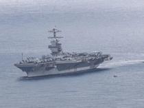 Iran claims missile strikes on US carrier, destroyer