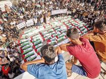 Gaza holds funeral for 100 Palestinians recovered from rubble of destroyed homes