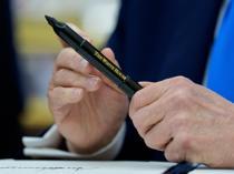 Trump signs bill authorizing sweeping Russia sanctions