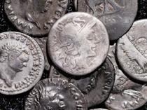 Amateur archaeologist finds Germany’s biggest hoard of Roman coins