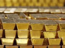 Gold slips as dollar and bond yields weigh