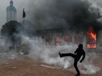 France counts cost of violent protests, 1,800 arrested