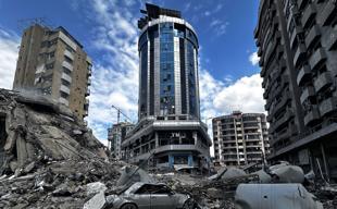 Iran says can fight for months as Israel strikes Beirut hotel