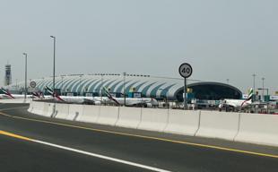 Drones fall near Dubai airport, ships hit as Iran presses on with attacks