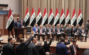 Iraq PM vows monopoly on arms as parliament approves gov’t
