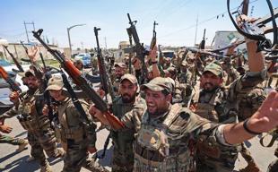 Iraq sets September deadline for integration of armed groups