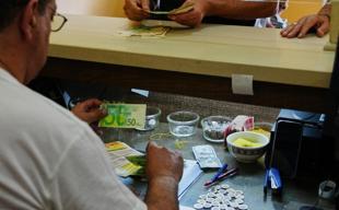 In Isareli-occupied West Bank, too much cash breaks economy