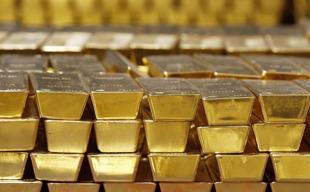 Gold slips as dollar and bond yields weigh