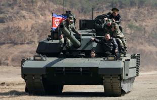 North Korean leader, daughter try out new tank