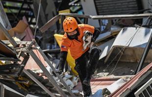 Outdoor hospitals, shaken communities as Philippine quake toll rises
