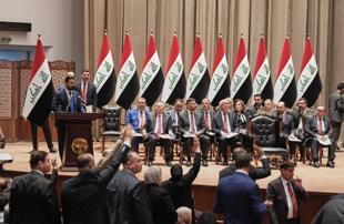Iraq PM vows monopoly on arms as parliament approves gov’t