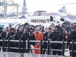 Suspect in health CEO killing charged with murder in New York