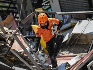 Outdoor hospitals, shaken communities as Philippine quake toll rises