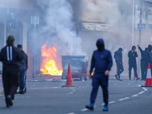 Protesters torch buildings and vehicles, block roads over Belfast stabbing