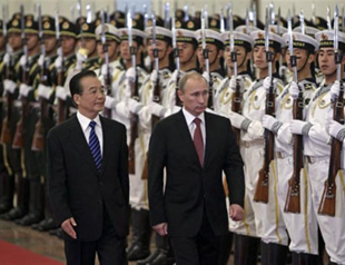 Russian PM Putin in China seeking closer ties
