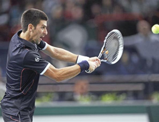 Djokovic reaches quarterfinals