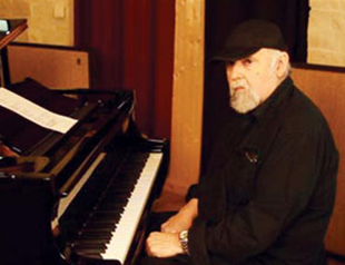 Juan Carlos Caceres on stage at CRR Concert Hall