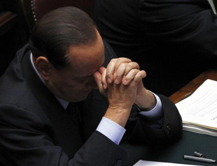 Berlusconi says will resign after economic reforms