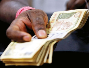 Rupee hits all-time low against dollar with slowdown in Indian economy