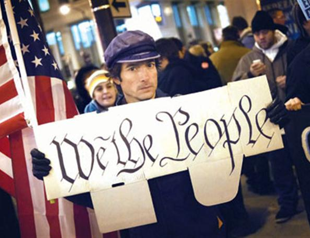 Protesters march into 3rd month