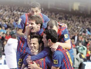 Barca back on track with El Clasico win