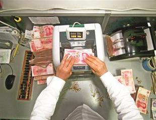 China to widen yuan trading band gradually