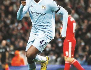 Man City thrashes Liverpool to stay on top