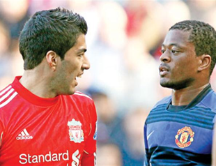 Suarez charged with racially abusing Evra