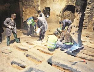 Works unearth graves in underground city