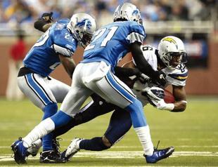 Lions reach playoffs, Patriots get first-round bye