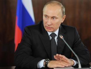 Putin denounces US, warns Russian protestors