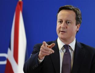 UK threatens eurozone, stays out of treaty