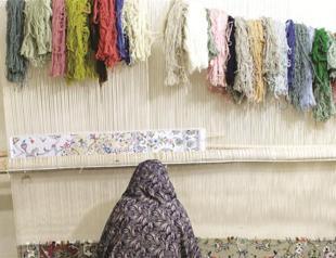 Iran weaves technology into its Persian carpets