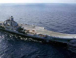 Russian naval flotilla docks in Syria: state media