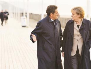 Merkel and Sarkoz vow fast action as crisis bites