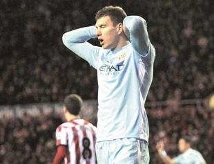 Mancini urges Man City to tighten up